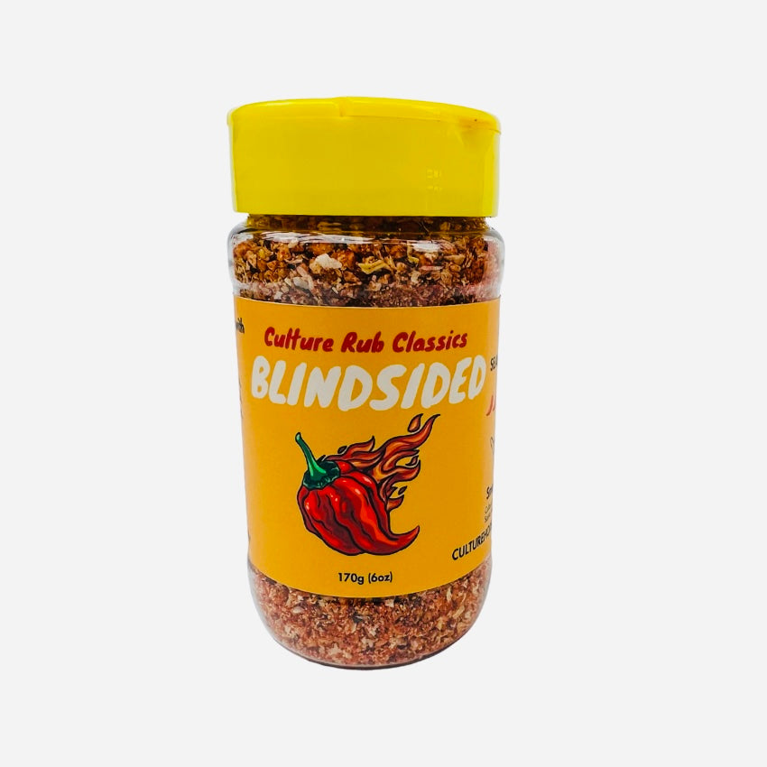 Blindsided rub seasoning– a bold, supremely spicy, and smoky blend inspired by our hottest and most popular sauce. Featuring Carolina Reaper heat with sweet Hungarian paprika, chipotle, cumin, and Szechuan peppercorn, this salt-free mix delivers a hot, vibrant flavor with a lingering smoky kick. Perfect for BBQ, hummus, mac 'n' cheese, eggs, chili, steak, corn, ribs, chilaquiles, pork chops, dips, and tacos. Family farm sourced, fresh ground, with no preservatives or additives—pure fire in every bite! spice