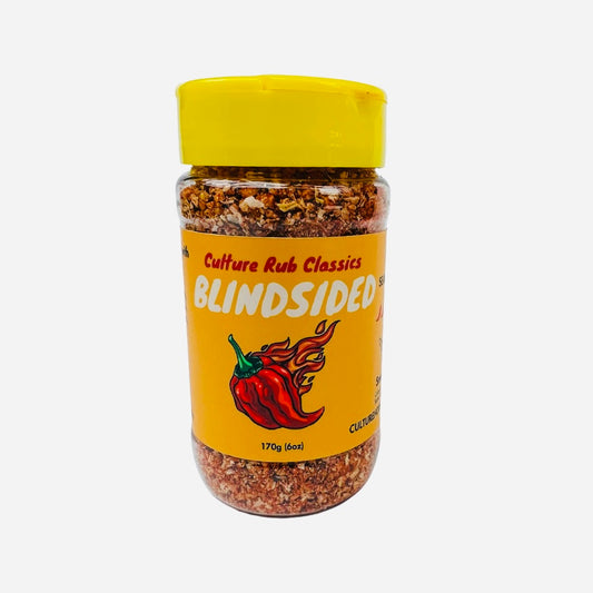 Blindsided rub seasoning– a bold, supremely spicy, and smoky blend inspired by our hottest and most popular sauce. Featuring Carolina Reaper heat with sweet Hungarian paprika, chipotle, cumin, and Szechuan peppercorn, this salt-free mix delivers a hot, vibrant flavor with a lingering smoky kick. Perfect for BBQ, hummus, mac 'n' cheese, eggs, chili, steak, corn, ribs, chilaquiles, pork chops, dips, and tacos. Family farm sourced, fresh ground, with no preservatives or additives—pure fire in every bite! spice