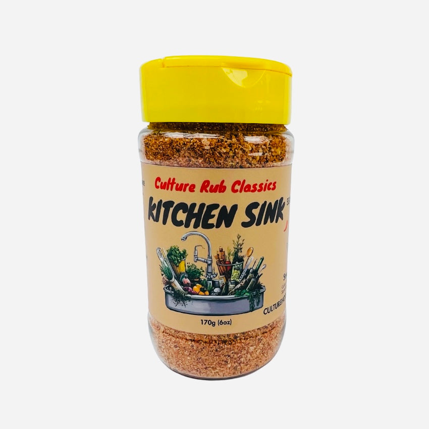 Kitchen Sink Rub– a warm, sweet, earthy, and pungent spice blend with mild chili, garam masala, garlic, onion, mineral salt, and aromatic spices.  This lightly salted, all-encompassing blend enhances lamb, potatoes, meats, stews, chicken, beef, cauliflower, squash, hummus, casseroles, vegetables, and ribs.  Perfect for adding depth and balance to any dish! spice jar front seasoning